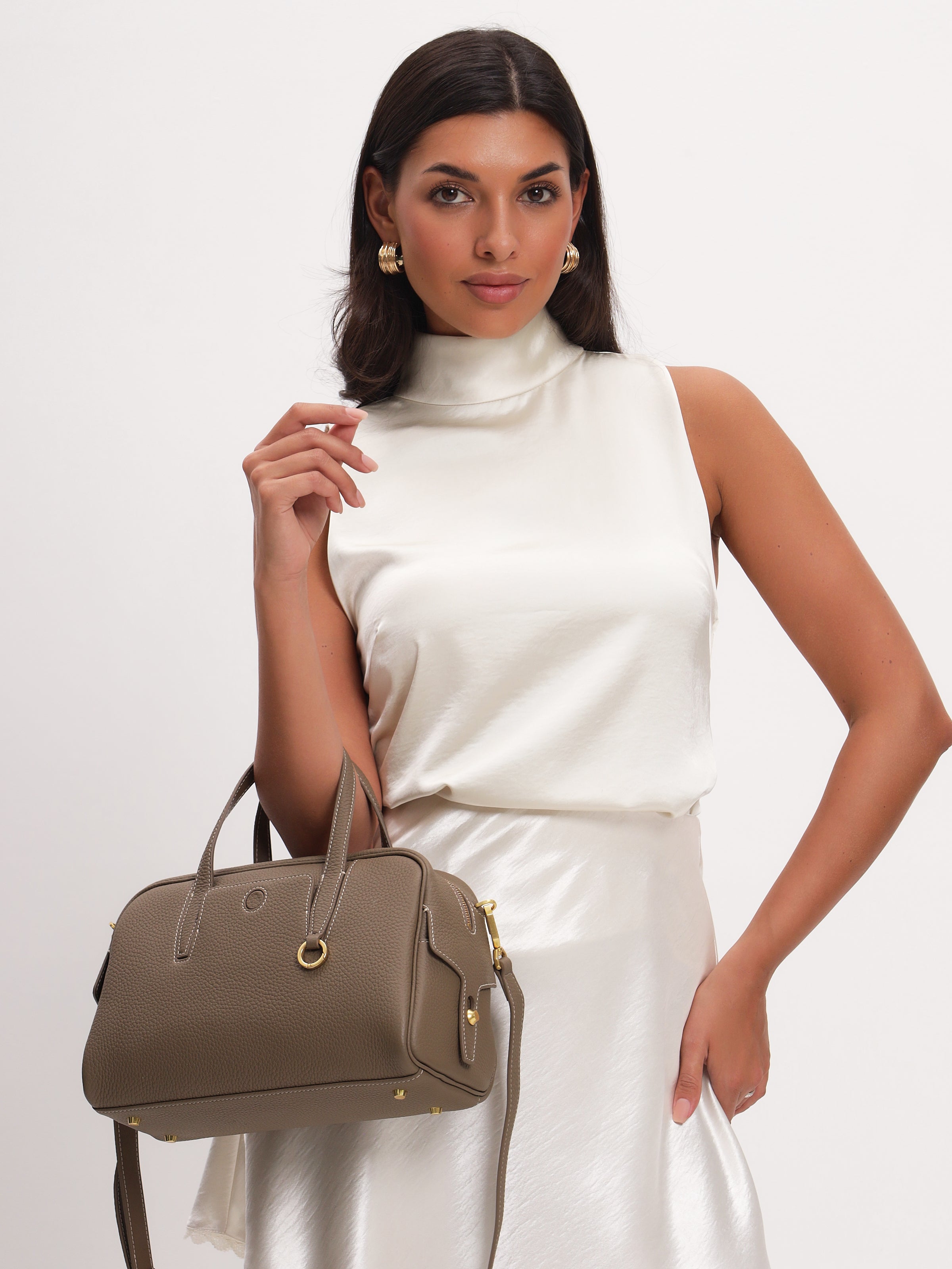 Taupe leather shoulder bag with gold hardware and top handles