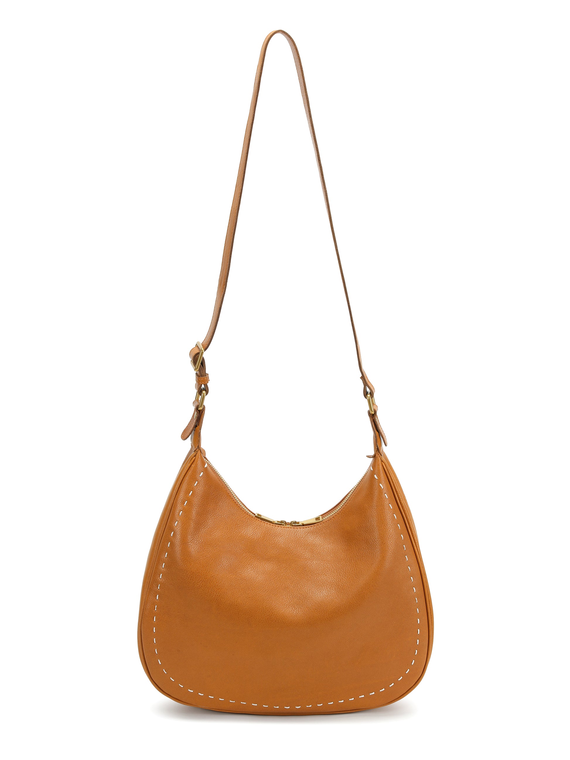 Tan leather hobo handbag with white stitching, curved shape and long shoulder strap