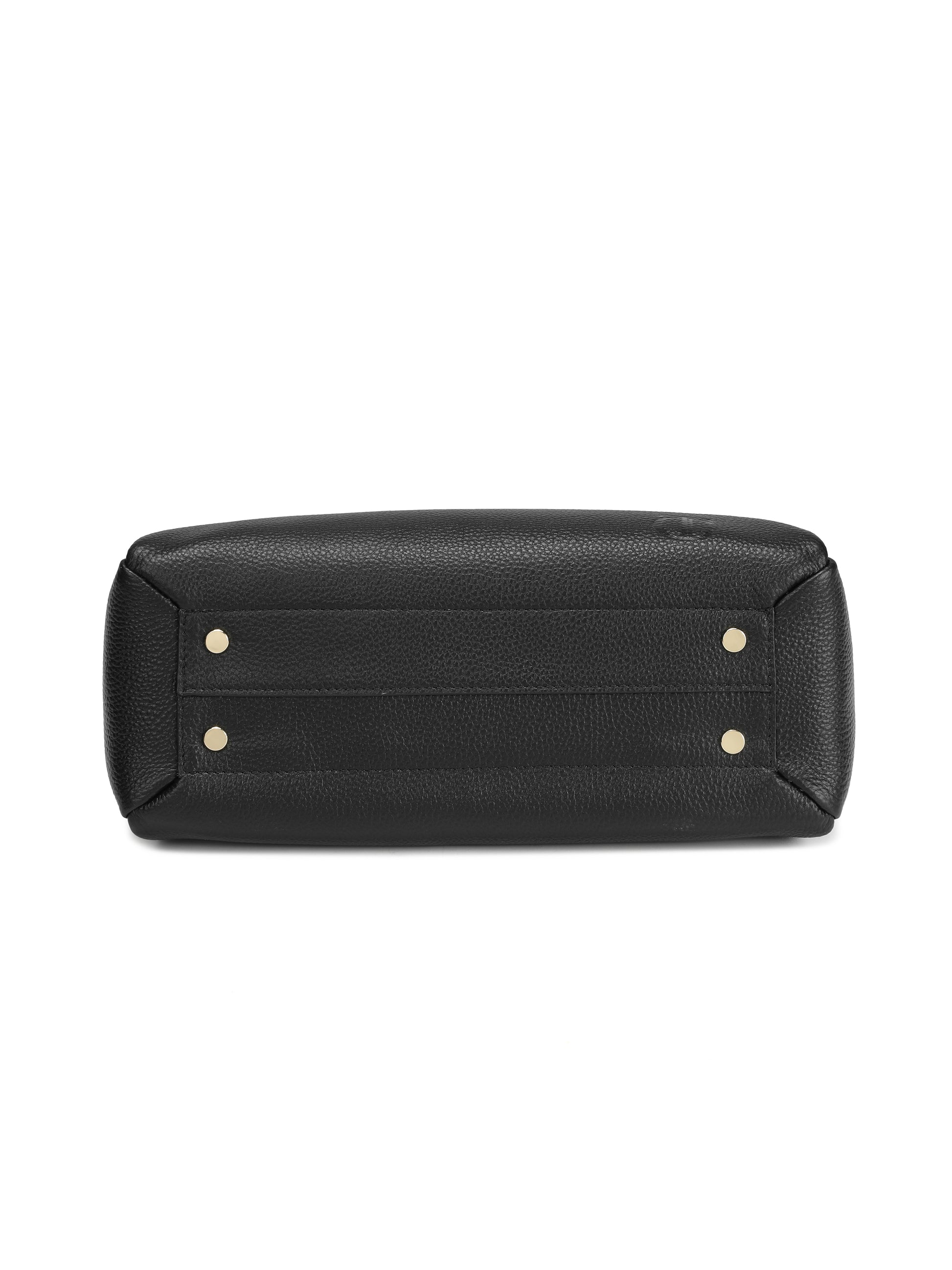 Black leather handbag base with gold metal feet, textured finish, close-up view