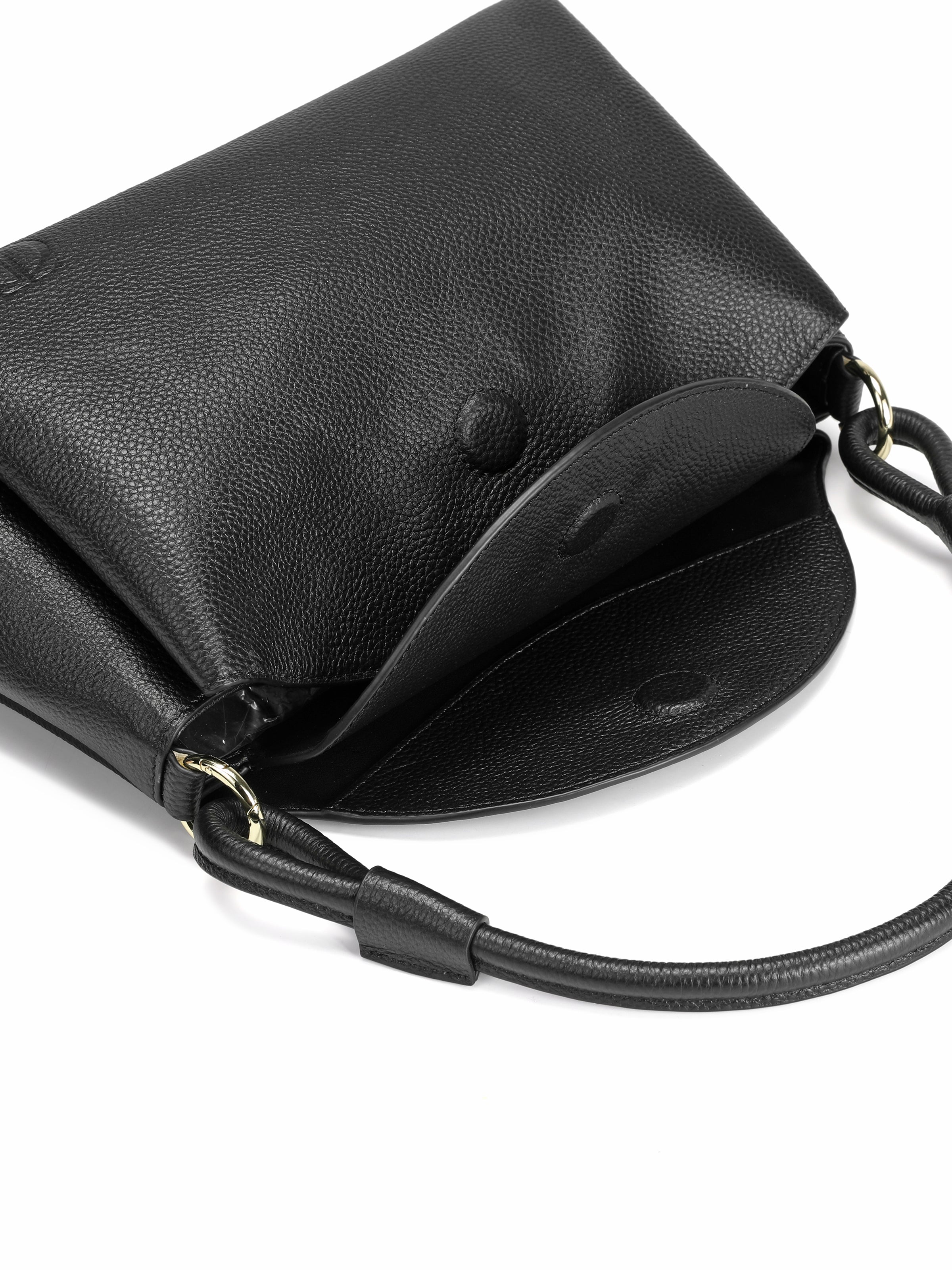 Black leather crossbody handbag with flap closure and gold hardware on white background