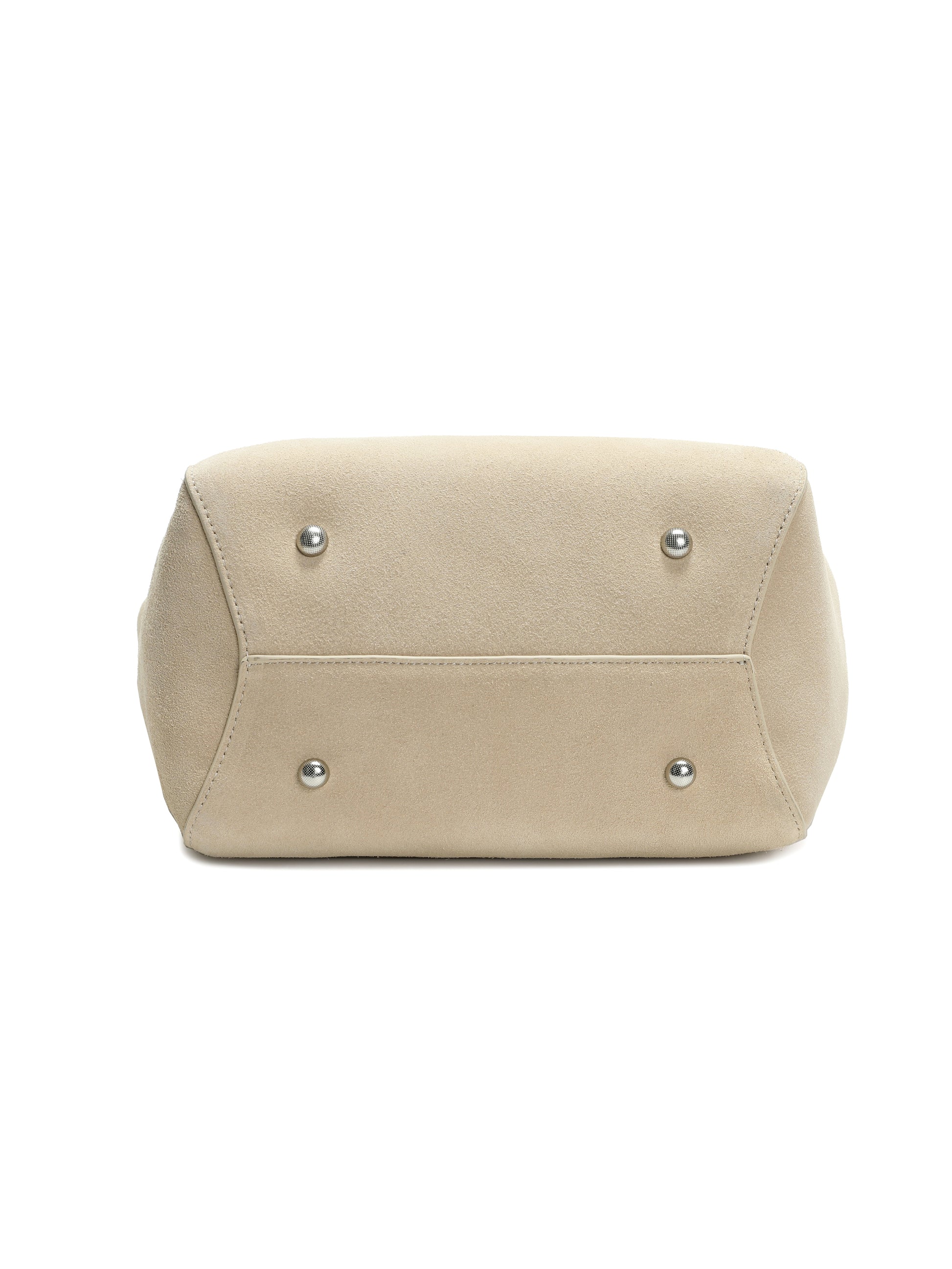 Beige suede handbag bottom view with silver metal feet, luxury purse design