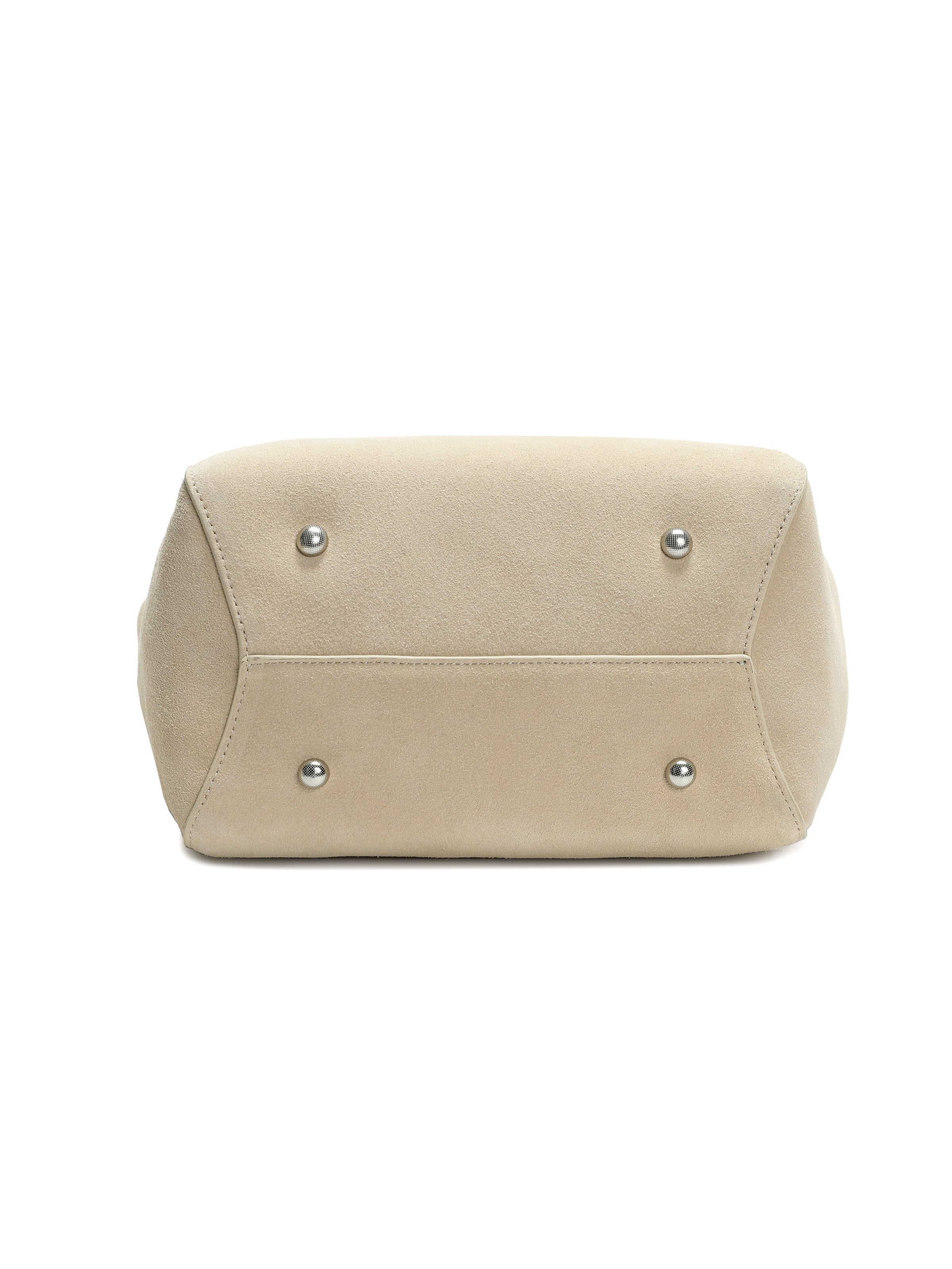 Beige suede handbag bottom view with silver metal feet, luxury purse design
