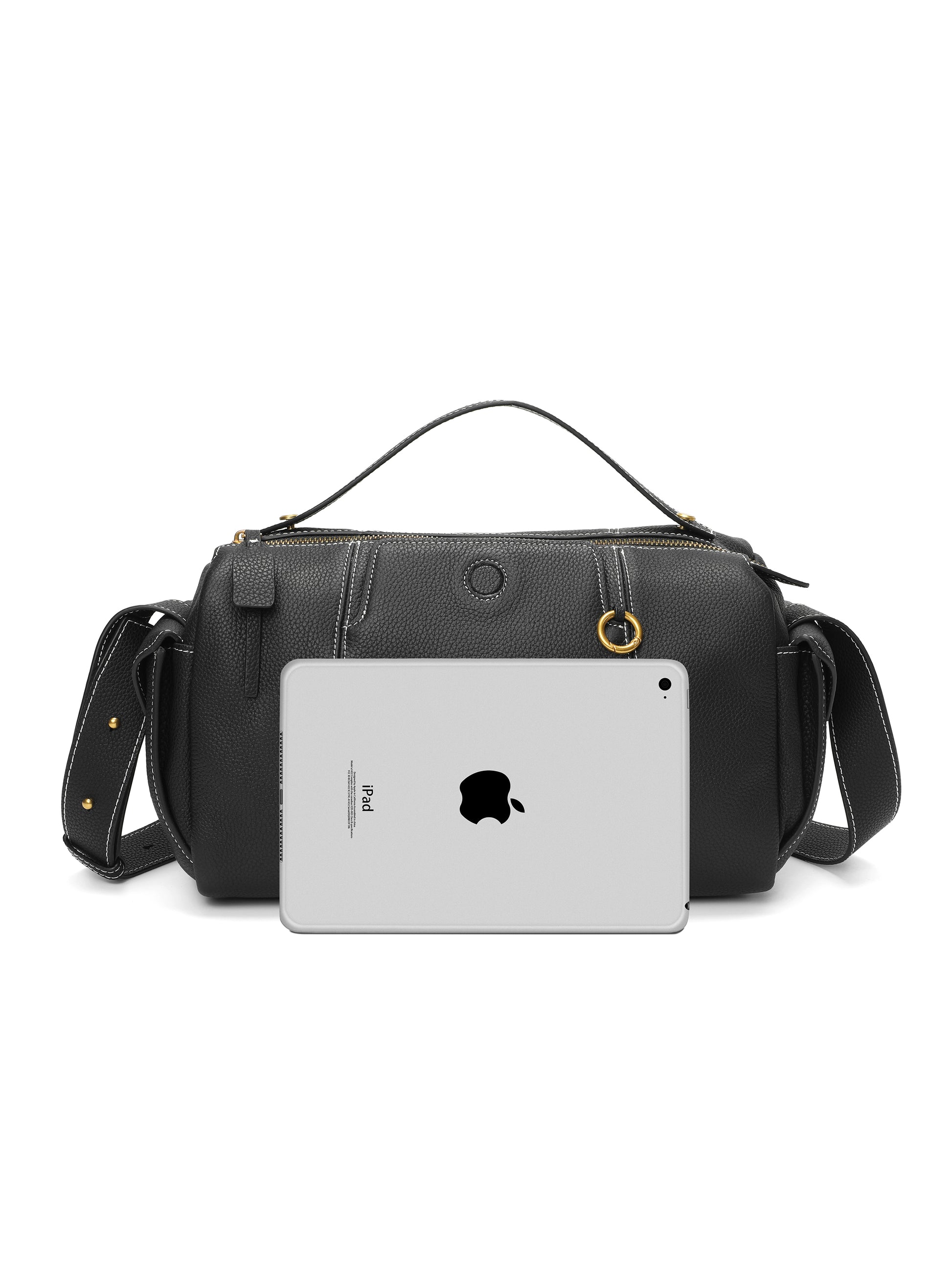 Black leather handbag with top handle and shoulder strap, shown with iPad for size comparison