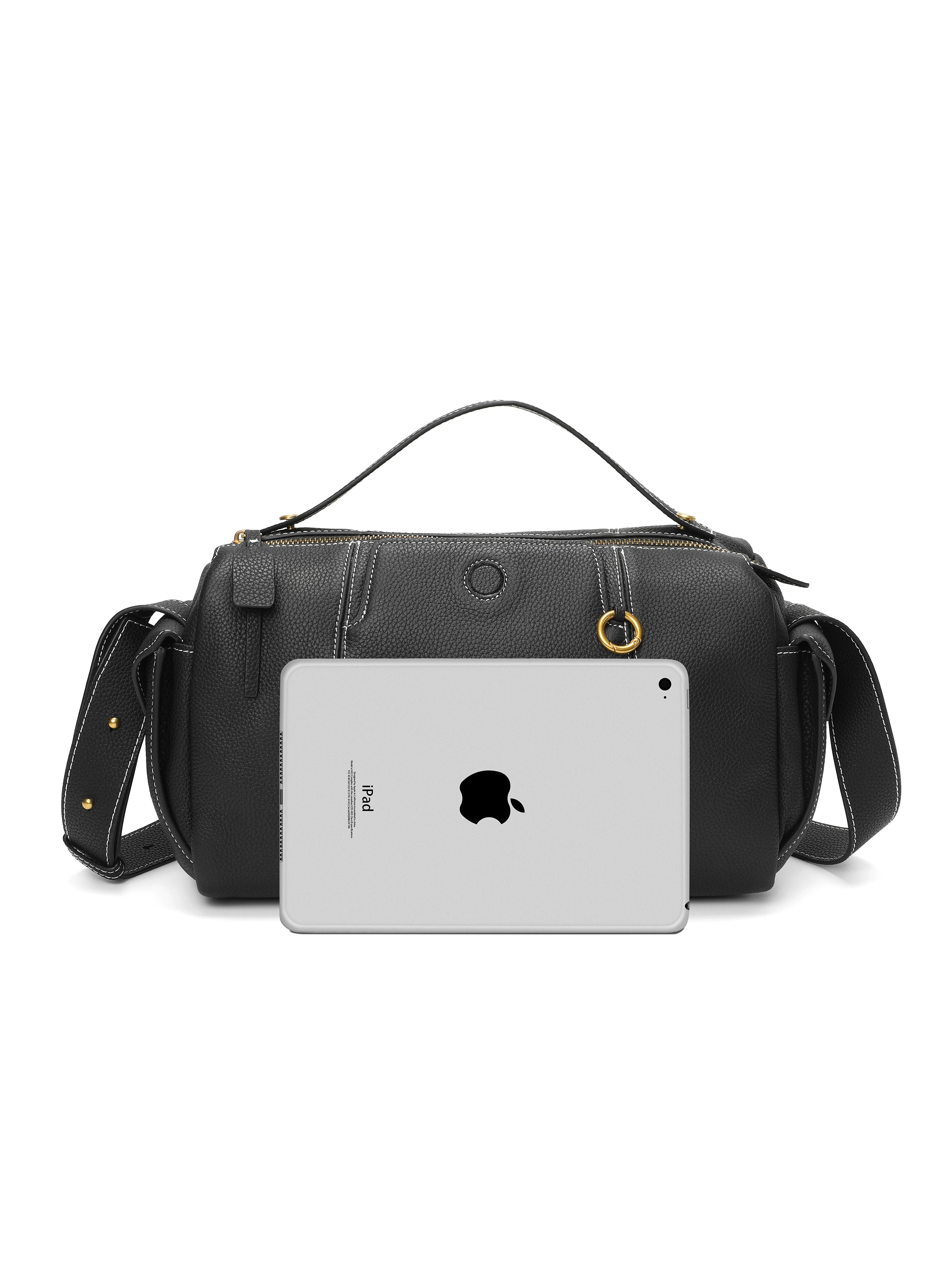 Black leather handbag with top handle and shoulder strap, shown with iPad for size comparison