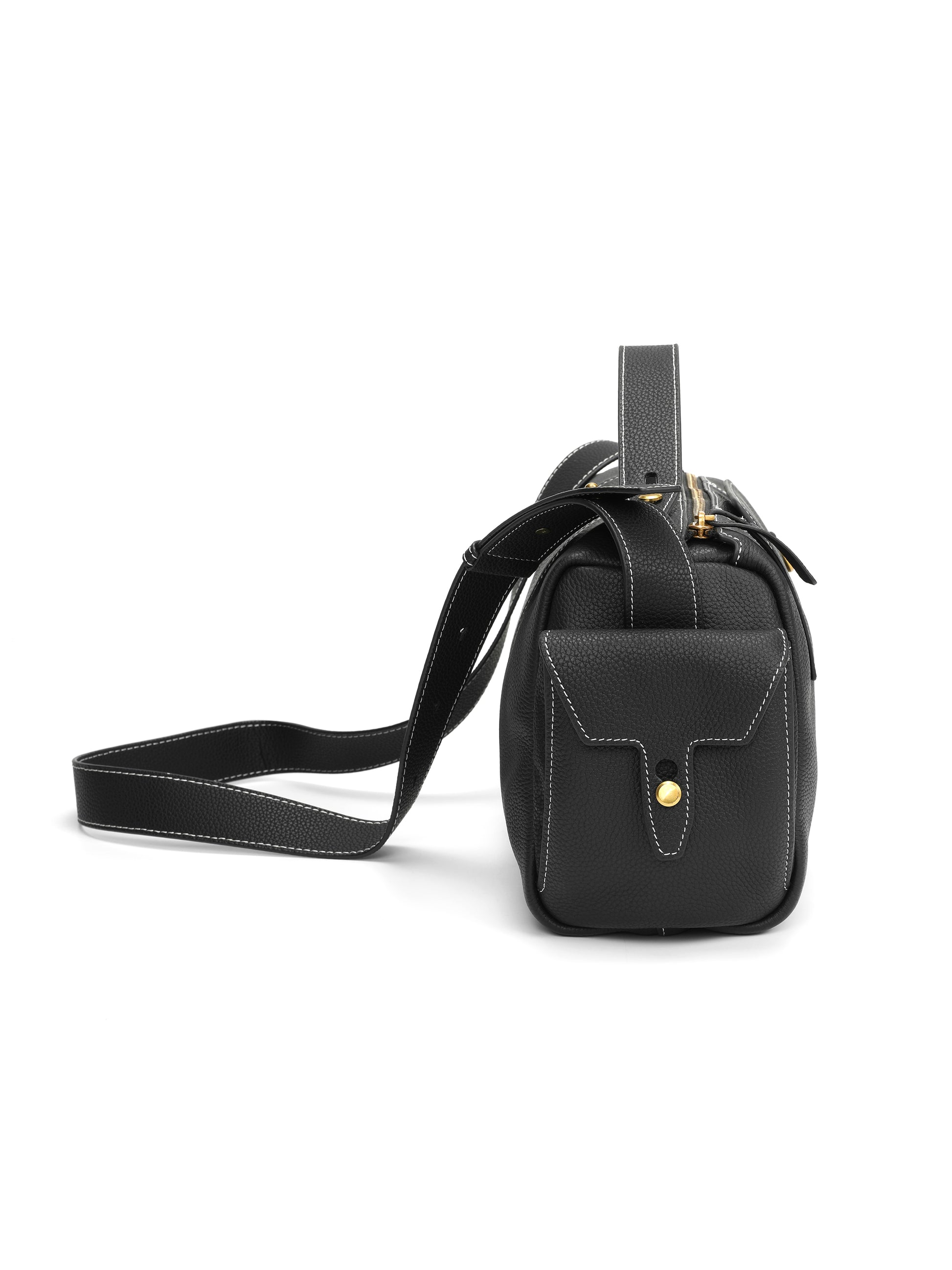 Black leather crossbody handbag with gold hardware and white stitching, side view