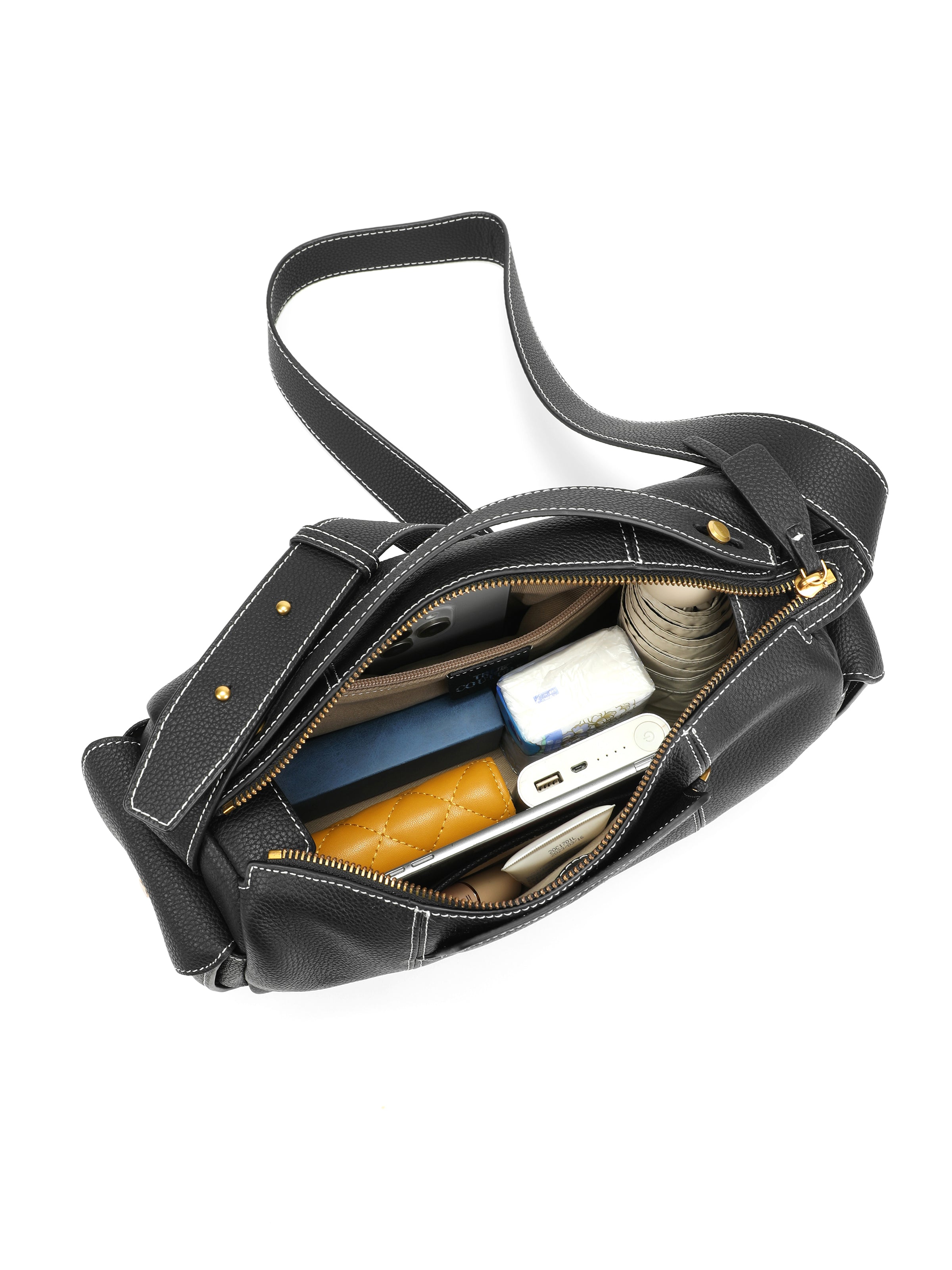 Top view of black leather shoulder bag with zipper, showing spacious interior with organized pockets.