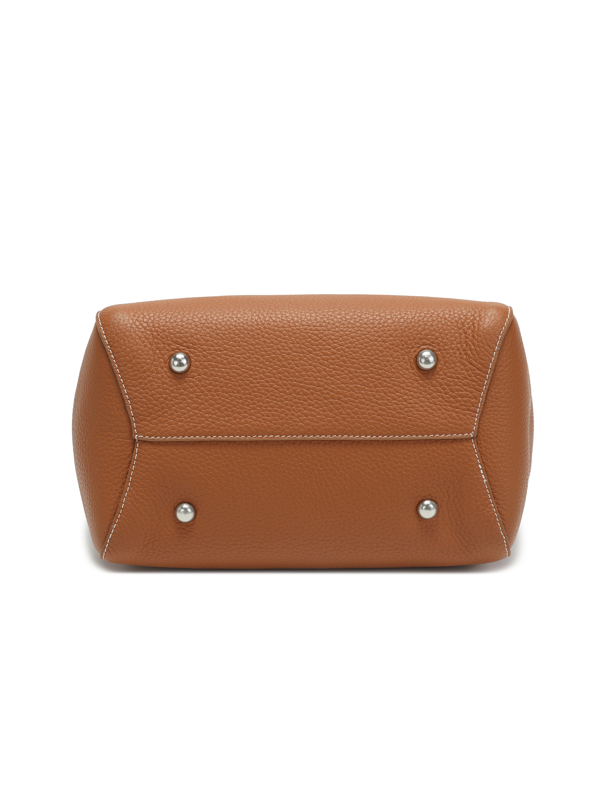 Bottom view of brown leather handbag with metal feet and white stitching