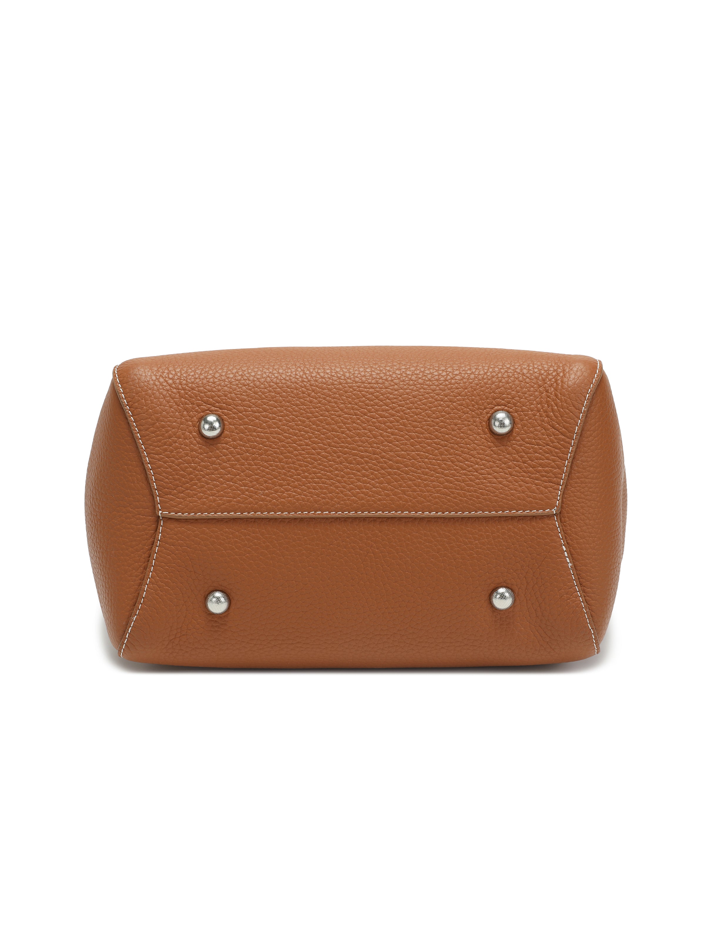 Bottom view of brown leather handbag with metal feet and white stitching