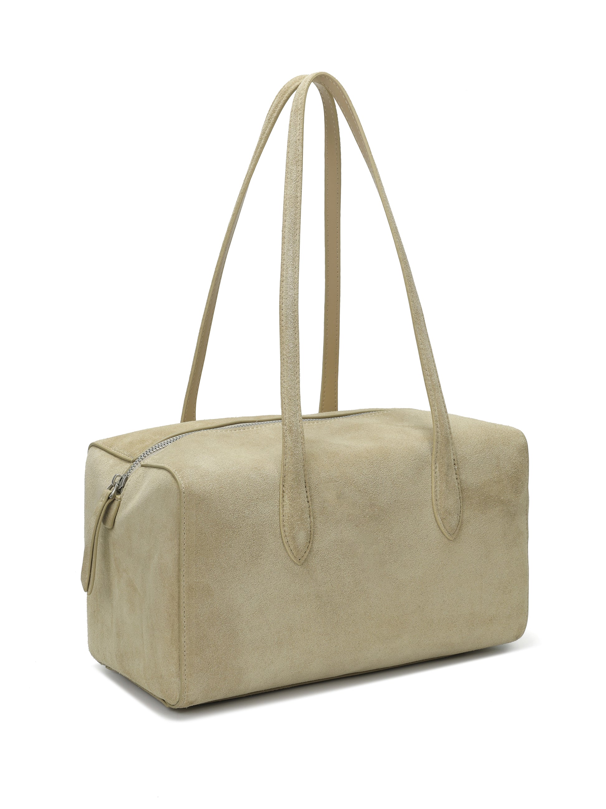 Tan suede boxy handbag with long double shoulder straps and zip closure on white background