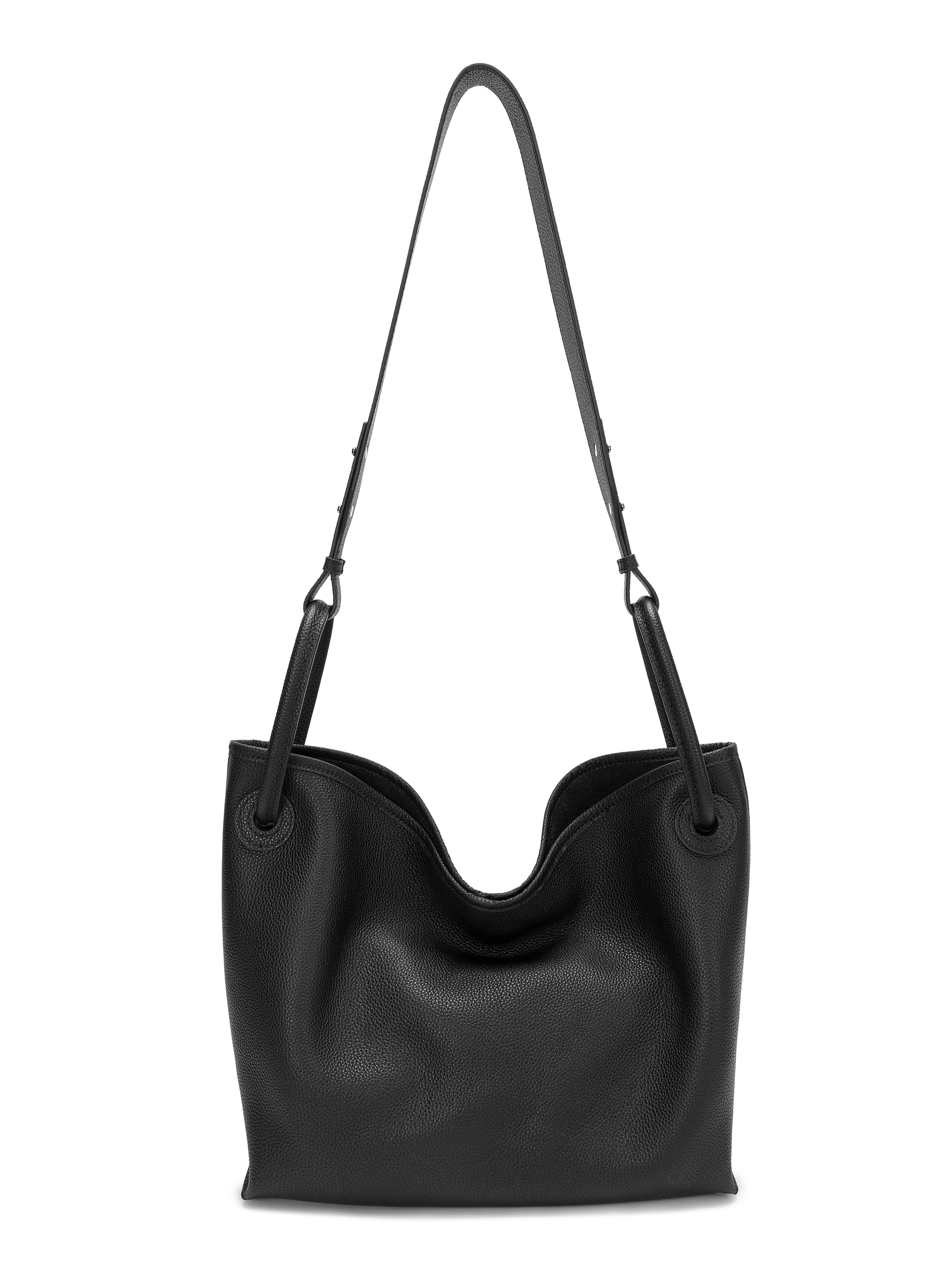 Black leather shoulder bag with adjustable strap and minimalist bucket design on white background